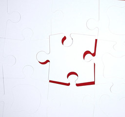 white large blank puzzles on a red background, top view