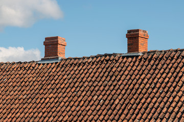 Old clay tile roof and sky.