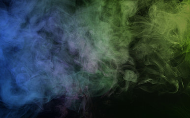 Obraz na płótnie Canvas Abstract smoke on a dark background. Movement of color smoke