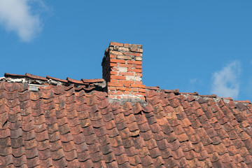 Naklejka premium Old clay tile roof and sky.