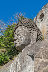 Mount Nokogiri (Nokogiriyama) Great Buddha (Nihon-ji daibutsu). Carving of seated sculpture of Yakushi Nyorai completed in 1783.  The largest pre-modern stone-carved Daibutsu in Japan