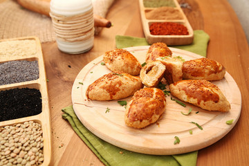 Patty with ingredients on the wooden table