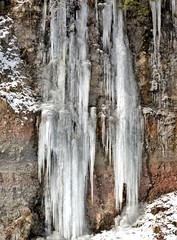Long icicles off a cliff