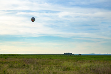 Hot-air balloon over grassland in Thuringia, Germany