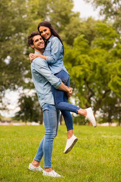 Full body profile photo of overjoyed pair spending best date in green park wear casual denim outfit