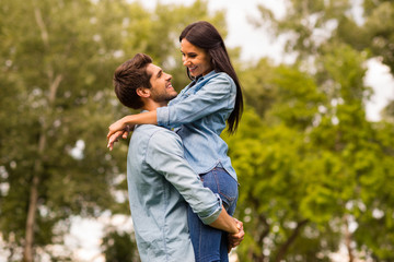 Fototapeta premium Profile photo of overjoyed pair spending best date in green park wear casual denim outfit
