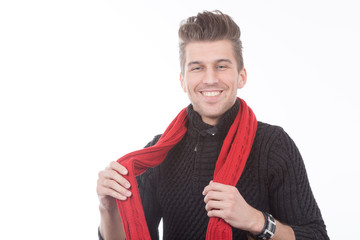 young handsome man in black sweater and a red scarf