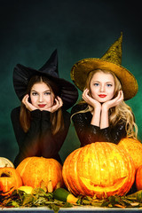 cute witches with pumpkins