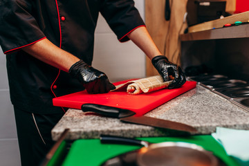 Japanese chef in restaurant cook sushi