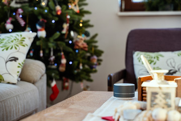 Smart ai speaker. Smart home concept with christmas tree in background