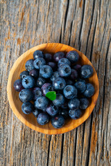 fresh blueberries in a wooden bowl