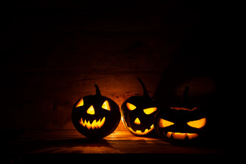 Halloween pumpkin head jack lantern in dark background