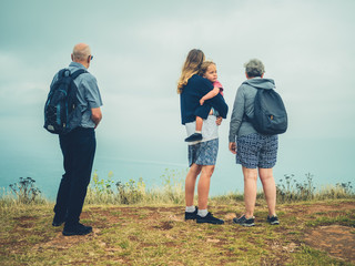 Real family of mother toddler and grandparents in the fog