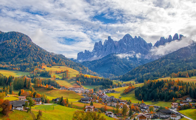 Fototapeta na wymiar Colorful autumn scenery in Santa Maddalena village at sunny day. Dolomite Alps, South Tyrol, Italy.
