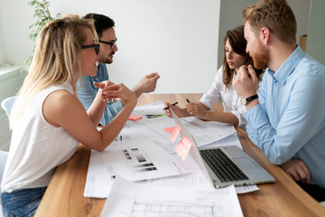 Group of architects and business people working together and brainstorming