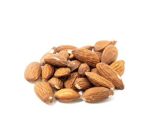 stack of almonds white background soft focus