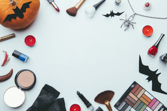 Image of shadows, brushes, halloween spider, ghost on empty white background.