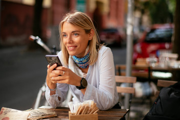 Young woman in cafe texting