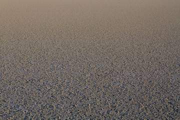 Mud flat background during the ebb tide at the sunset. 
