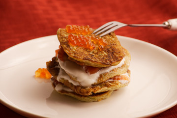 zucchini fritters and red caviar