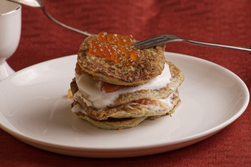 zucchini fritters and red caviar