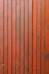 Fototapeta premium stained wood planks fence background - vertical lines