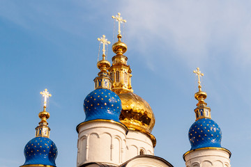 Domes and crosses of the Orthodox Church against the blue sky.