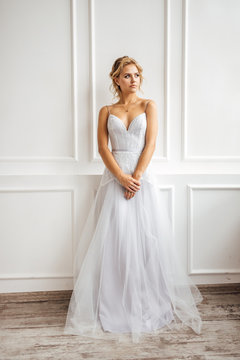 bride in beautiful dress in white Studio