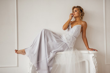 bride in beautiful dress in white Studio
