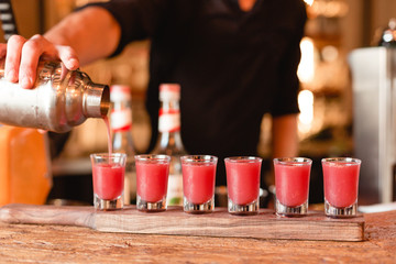 Light and invigorating pink drink in shots