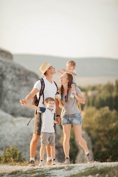 Beautiful Family In The Mountains. Tourism. Campaign. Fall.