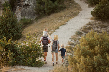 Beautiful family in the mountains. Tourism. Campaign. Fall.