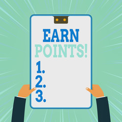 Conceptual hand writing showing Earn Points. Concept meaning collecting scores in order qualify to win big prize Two male hands holding electronic device geometrical background