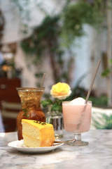 Working in a coffee shop. Laptops were paired with tea, flowers, vases and cakes.Working in a cafe allowing us to enjoy the environment well.