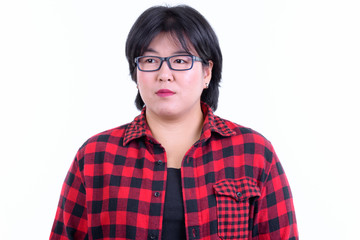 Face of beautiful overweight Asian hipster woman thinking