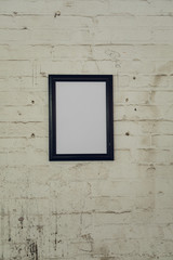 Blank picture hanging on a wall