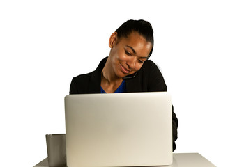 Young businesswoman using a laptop and smartphone
