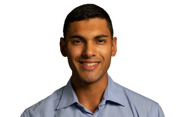 Young smiling businessman looking to camera