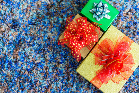 Christmas Many Gifts On Blue Carpet Interior Of Top View With Background With Copy Space,Decoration During Christmas And New Year.