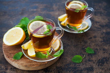 Black hot tea with lemon and mint. Warming autumn revitalizing drink.