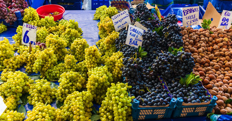 green and black grapes in a turkish market / bazaar