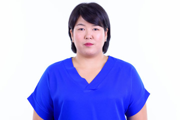 Face of beautiful overweight Asian businesswoman looking at camera