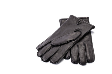 Pair of men's black leather gloves isolated on white background.