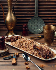 Fried meat with rice in sauce