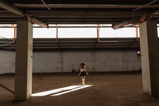 Female dancer in an empty warehouse