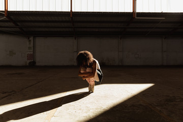 Female dancer in an empty warehouse