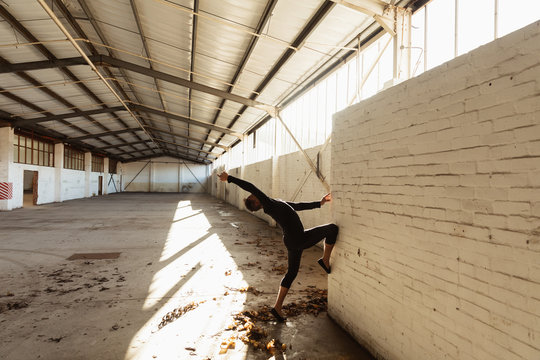 Male dancer in an empty warehouse