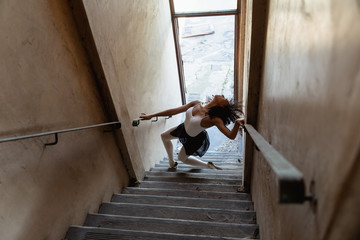 Female dancer in an empty warehouse