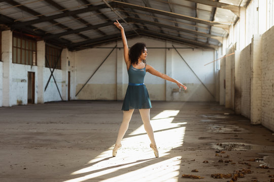 Female dancer in an empty warehouse