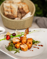 Chicken roulets with vegetables and sauce